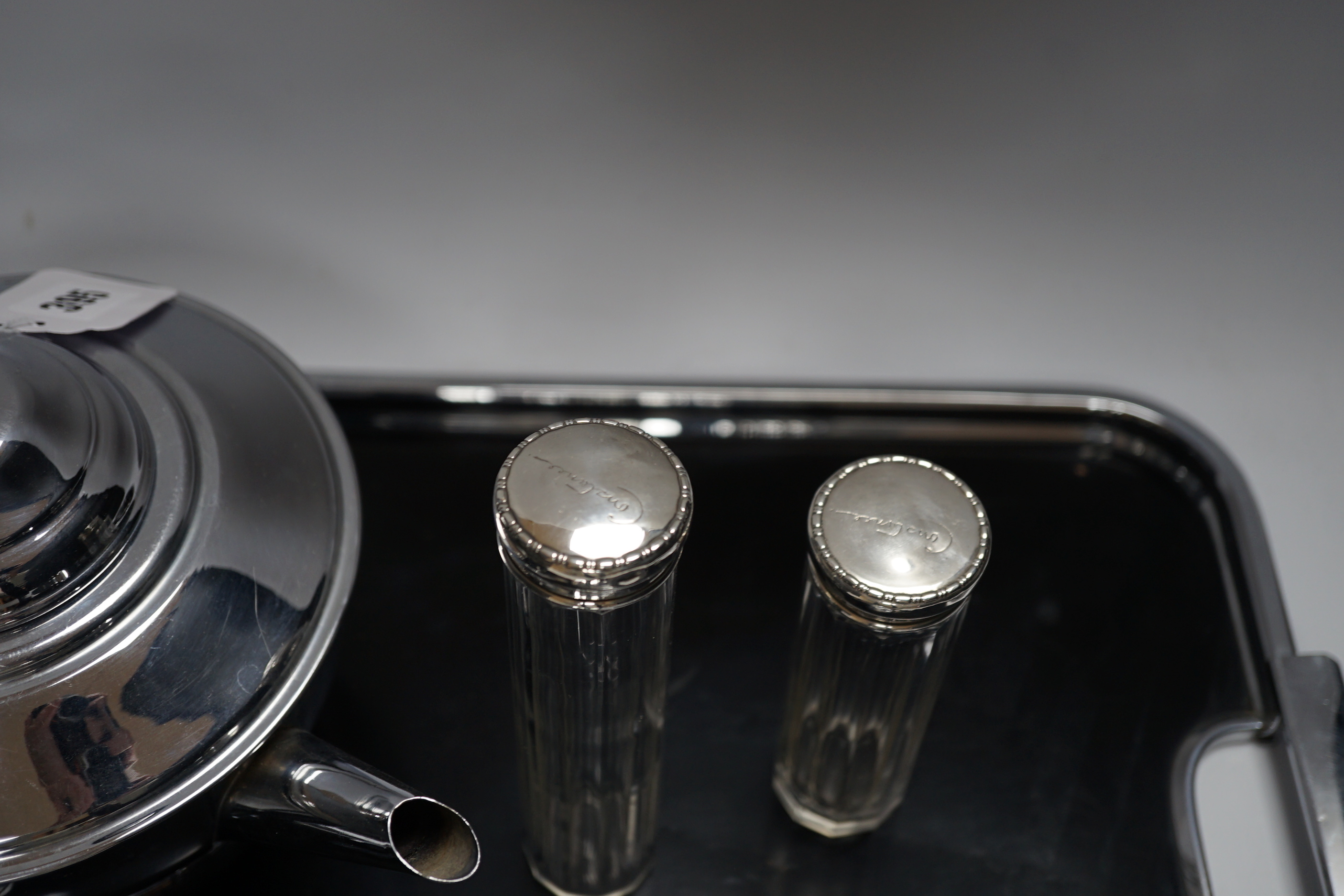 An Art Deco style plated teaset and tray and two silver jars